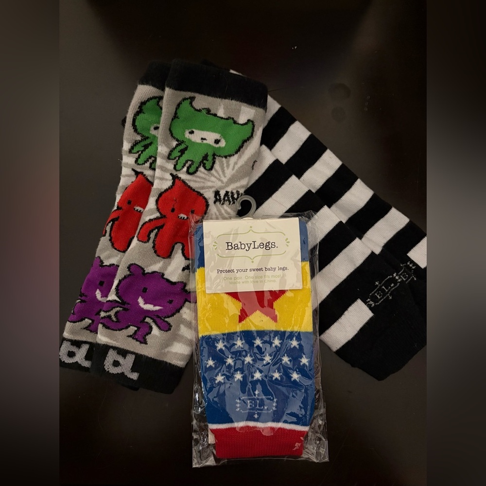 Babylegs infant leg warmers lot of 3 
One new in packages
Two gently used